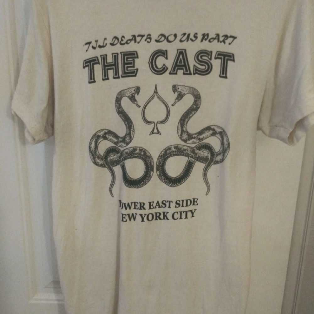 Mens medium cream colored t-shirt w/ The Cast